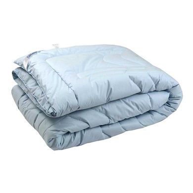 Теплое шерстяное одеяло голубое в тике 140х205