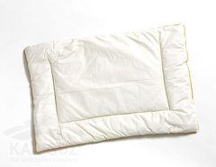 Дитяча вовняна подушка біла в бязі 40х60